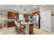 Well-equipped kitchen featuring granite countertops, stainless steel appliances, and a convenient breakfast bar area at 5457 Animosh Ct, Polk City, FL 33868