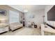 Office space featuring a comfortable sofa, bright window, stylish lighting, and modern decor at 5457 Animosh Ct, Polk City, FL 33868