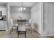 Bright dining area featuring tile floors, modern lighting, and a closet for storage at 5530 Chrishire Way # D204, Orlando, FL 32822