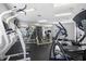 Modern fitness center equipped with weight machines, treadmills, and mirrored walls at 5530 Chrishire Way # D204, Orlando, FL 32822