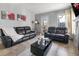 Comfortable living room with tile floors, neutral paint, and plenty of natural light at 5530 Chrishire Way # D204, Orlando, FL 32822