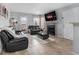 Cozy living room featuring tile floors, a fireplace, and access to the outdoor area at 5530 Chrishire Way # D204, Orlando, FL 32822