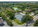 Aerial view of the community with tennis courts, pool and lake at 6 Escondido Cir # 58, Altamonte Springs, FL 32701