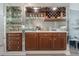 Mirrored bar area with cabinets, drawers, a wine rack, and glassware storage at 6 Escondido Cir # 58, Altamonte Springs, FL 32701
