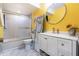 Bright bathroom features a modern vanity and shower-tub combo at 6 Escondido Cir # 58, Altamonte Springs, FL 32701