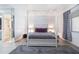 Charming bedroom with a four-poster bed and attached bathroom and window at 6 Escondido Cir # 58, Altamonte Springs, FL 32701