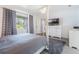 Inviting bedroom with comfortable bed and a view to the exterior at 6 Escondido Cir # 58, Altamonte Springs, FL 32701