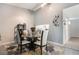 Bright dining area features a glass-topped table, stylish chairs, and tasteful décor at 6 Escondido Cir # 58, Altamonte Springs, FL 32701