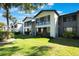Bright condo building with large windows and green lawns offers a desirable community setting and modern living at 6 Escondido Cir # 58, Altamonte Springs, FL 32701