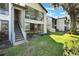 Well-maintained condo building featuring large windows, private entrance, and green lawn, offering a blend of comfort and style at 6 Escondido Cir # 58, Altamonte Springs, FL 32701