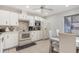 Kitchen with tile flooring, appliances, and a view to an adjacent breakfast nook at 6 Escondido Cir # 58, Altamonte Springs, FL 32701