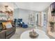 Bright living room with modern furniture, stylish accents, and a view into other rooms at 6 Escondido Cir # 58, Altamonte Springs, FL 32701