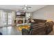Cozy living room with fireplace, stylish furniture, ceiling fan, and elegant decor at 6 Escondido Cir # 58, Altamonte Springs, FL 32701