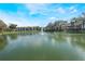 Scenic pond with a water fountain and surrounding apartment complex at 6 Escondido Cir # 58, Altamonte Springs, FL 32701