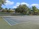 Well-maintained outdoor tennis courts, ready for a match under a sunny sky at 6 Escondido Cir # 58, Altamonte Springs, FL 32701