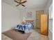 Cozy bedroom with a single bed, neutral flooring, and a simple design, ideal for relaxing at 6475 Peppertree Ne Path, Winter Haven, FL 33881