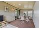 Enclosed patio area with carpet, neutral walls, and a seating arrangement for relaxing or entertaining at 6475 Peppertree Ne Path, Winter Haven, FL 33881
