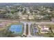 Aerial view highlighting the tennis courts, dog park, and surrounding residential community at 734 Olympic Cir # 30, Ocoee, FL 34761