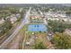 Aerial view showcasing tennis courts, dog park, and residential streets at 734 Olympic Cir # 30, Ocoee, FL 34761