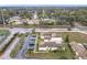Aerial view of property, parking, and roadways near community tennis courts at 734 Olympic Cir # 30, Ocoee, FL 34761