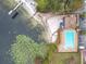 Top down view shows a sandy beach area, gazebo, and in-ground pool and lake at 734 Olympic Cir # 30, Ocoee, FL 34761