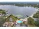 Beautiful aerial view of the community pool and lake access with mature trees at 734 Olympic Cir # 30, Ocoee, FL 34761