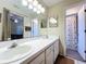 Well-lit bathroom showcasing double sinks, a spacious vanity, and tiled flooring at 734 Olympic Cir # 30, Ocoee, FL 34761