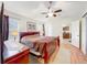 Bedroom with ceiling fan and convenient access to kitchen at 734 Olympic Cir # 30, Ocoee, FL 34761