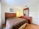 Cozy bedroom featuring a comfortable bed, dresser, and ample natural light at 734 Olympic Cir # 30, Ocoee, FL 34761