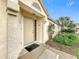 Inviting front entrance with concrete steps, neutral paint, and desert landscaping at 734 Olympic Cir # 30, Ocoee, FL 34761