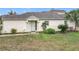 Charming single-story home featuring a well-maintained lawn and neutral exterior paint at 734 Olympic Cir # 30, Ocoee, FL 34761