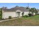 Charming single-story home featuring a well-maintained lawn and neutral exterior paint at 734 Olympic Cir # 30, Ocoee, FL 34761