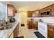 Efficient kitchen with granite countertops, stainless steel sink, and appliances at 734 Olympic Cir # 30, Ocoee, FL 34761