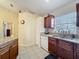 Bright kitchen with granite countertops, stainless steel sink, and plenty of cabinet space at 734 Olympic Cir # 30, Ocoee, FL 34761