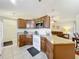 Open kitchen featuring granite countertops, ample cabinet space, and modern appliances at 734 Olympic Cir # 30, Ocoee, FL 34761