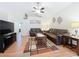 Bright living room with vaulted ceilings, ceiling fan, and modern geometric rug at 734 Olympic Cir # 30, Ocoee, FL 34761