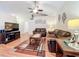 Inviting living room featuring comfortable seating, stylish decor, and wood laminate flooring at 734 Olympic Cir # 30, Ocoee, FL 34761
