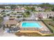 Beautiful in-ground community pool with tables and chairs for residents at 734 Olympic Cir # 30, Ocoee, FL 34761