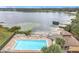 Beautiful in-ground swimming pool with brick surround and lounge chairs at 734 Olympic Cir # 30, Ocoee, FL 34761