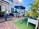 Charming backyard with brick patio, outdoor dining set, and lush greenery at 8628 Dufferin Ln, Orlando, FL 32832