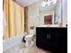Cozy bathroom featuring a shower/tub combo, modern vanity, and tile flooring at 8628 Dufferin Ln, Orlando, FL 32832