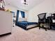 A bedroom with a large window for natural light and comfortable carpet at 8628 Dufferin Ln, Orlando, FL 32832