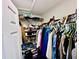 Walk-in closet features ample storage for clothing and accessories at 8628 Dufferin Ln, Orlando, FL 32832