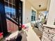 View of the front porch showcases a seating area, flower pots, and a well-maintained exterior at 8628 Dufferin Ln, Orlando, FL 32832