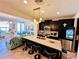 Modern kitchen with a spacious island, stainless steel appliances, and stylish lighting at 8628 Dufferin Ln, Orlando, FL 32832