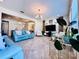 Open-concept living space with ample natural light and access to kitchen and dining areas at 8628 Dufferin Ln, Orlando, FL 32832