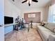 Comfortable office space with desk, shelving, and sofa, providing a functional workspace at 8628 Dufferin Ln, Orlando, FL 32832