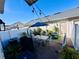 Inviting patio with a dining table, umbrella, and lush greenery for outdoor enjoyment at 8628 Dufferin Ln, Orlando, FL 32832