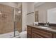 Cozy bathroom showcasing a glass door shower and vanity sink at 8971 Majesty Palm Rd, Kissimmee, FL 34747