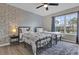 Upstairs bedroom with two beds, a window and a ceiling fan at 8971 Majesty Palm Rd, Kissimmee, FL 34747